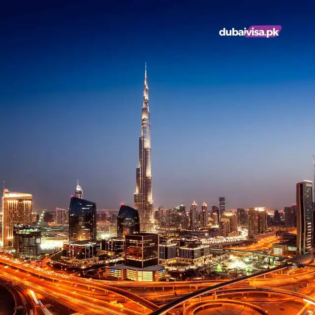 Downtown Dubai skyline and the Burj Khalifa lit up at dusk