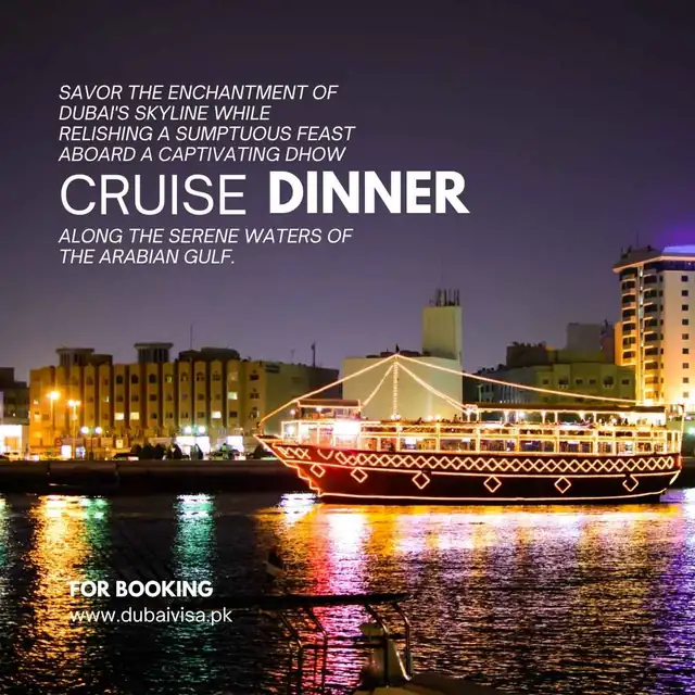 Dhow cruise dinner boat lit up on Dubai Creek at night
